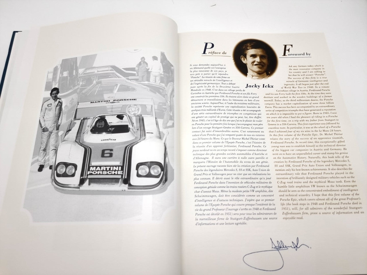 Open hardcover book with racing car image on left and a portrait with biography text