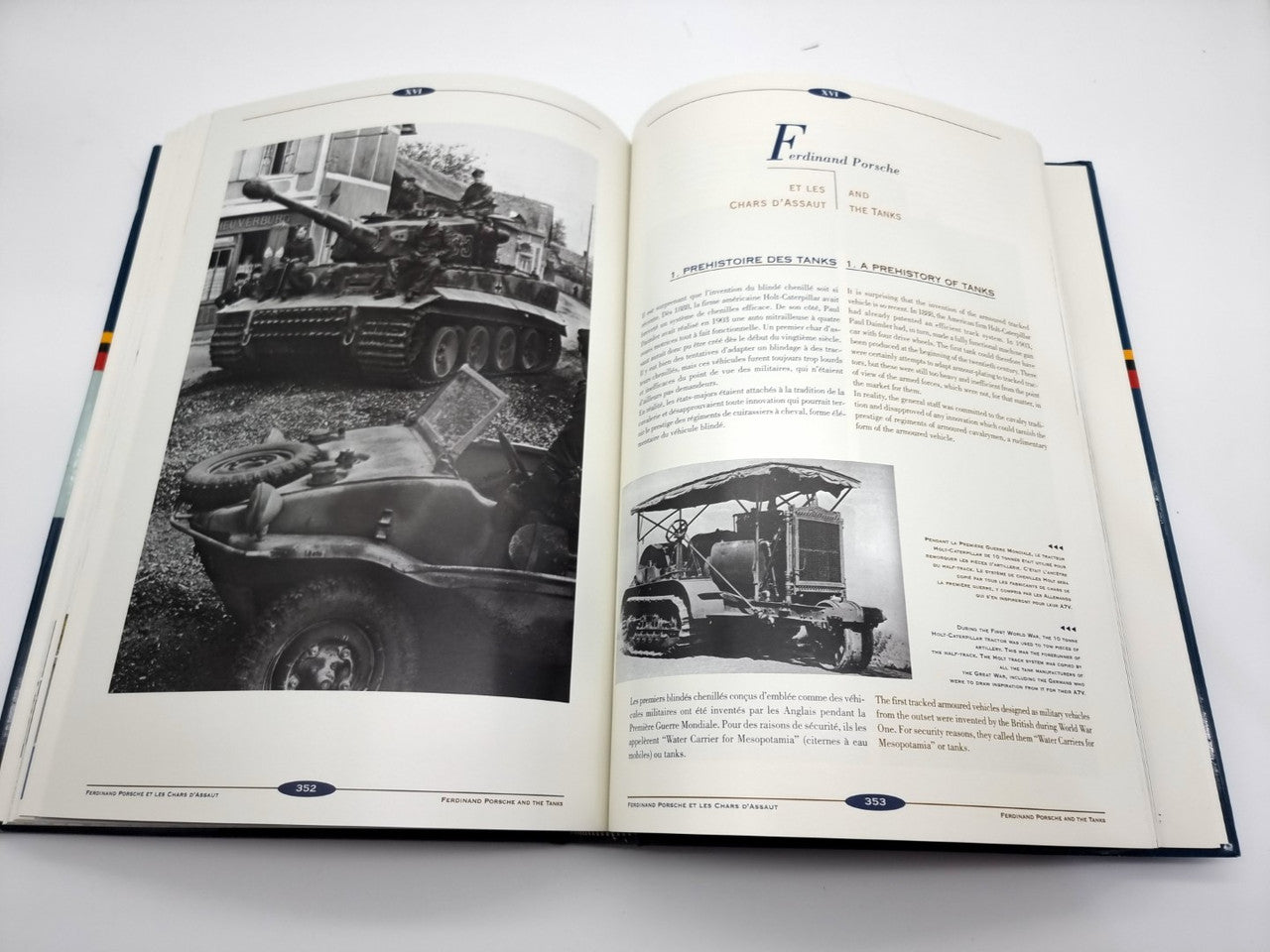 Open hardcover book with two pages of photos and text, blue endpapers and markers