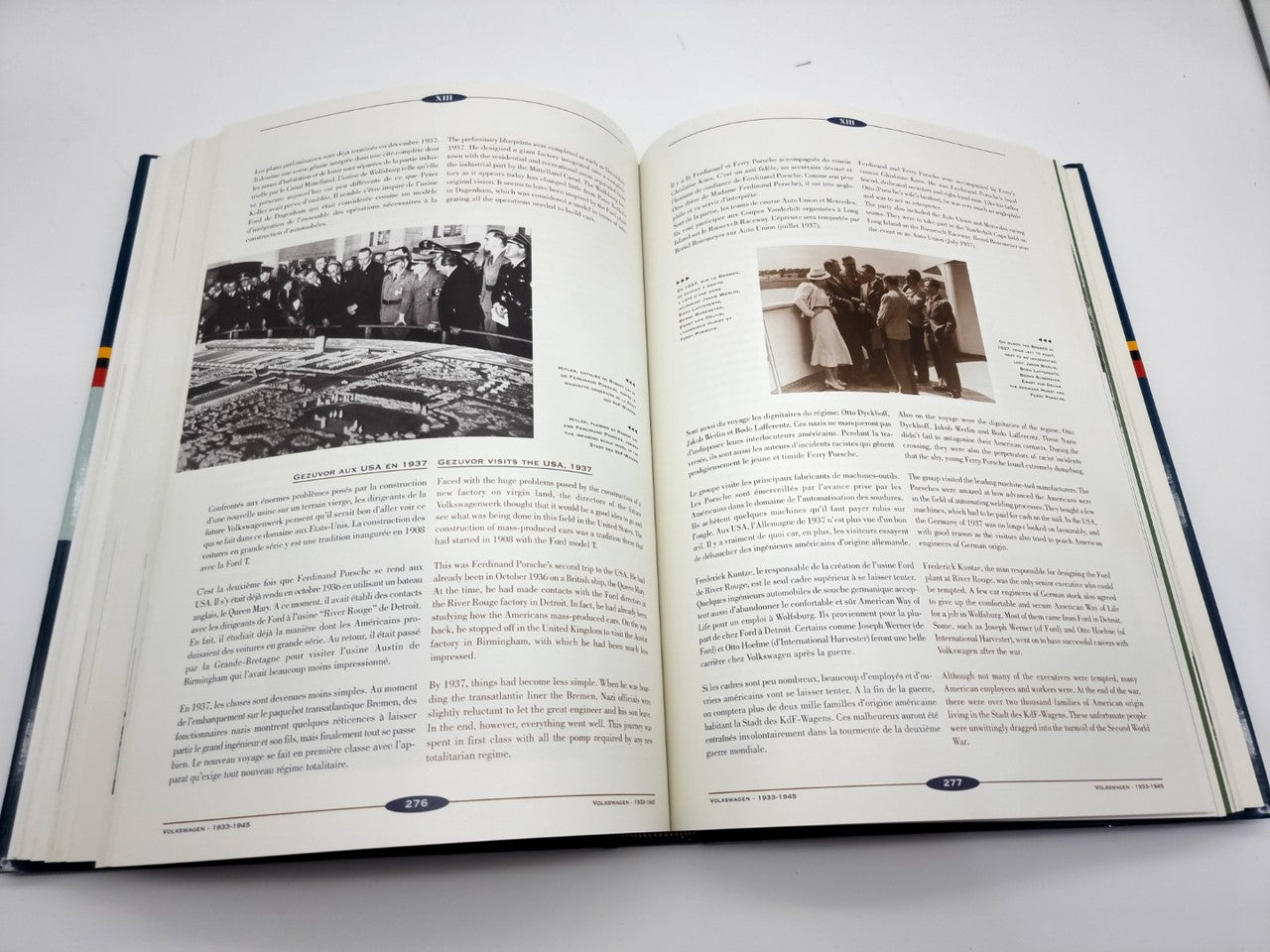 Open hardcover book with two dense text pages and a small photo inset on the right