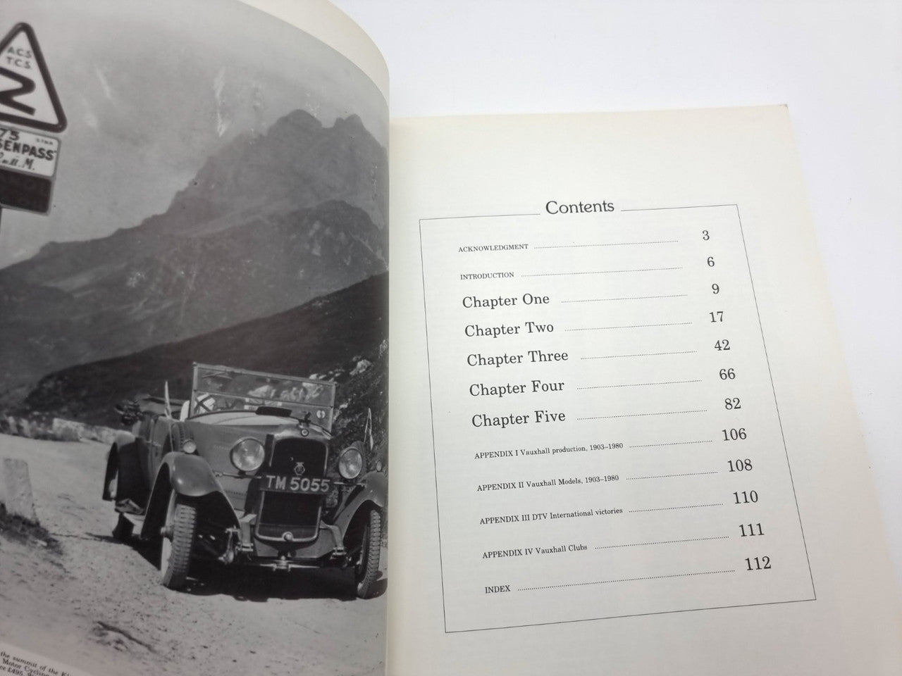 Book contents page with chapter list and black-and-white car photo