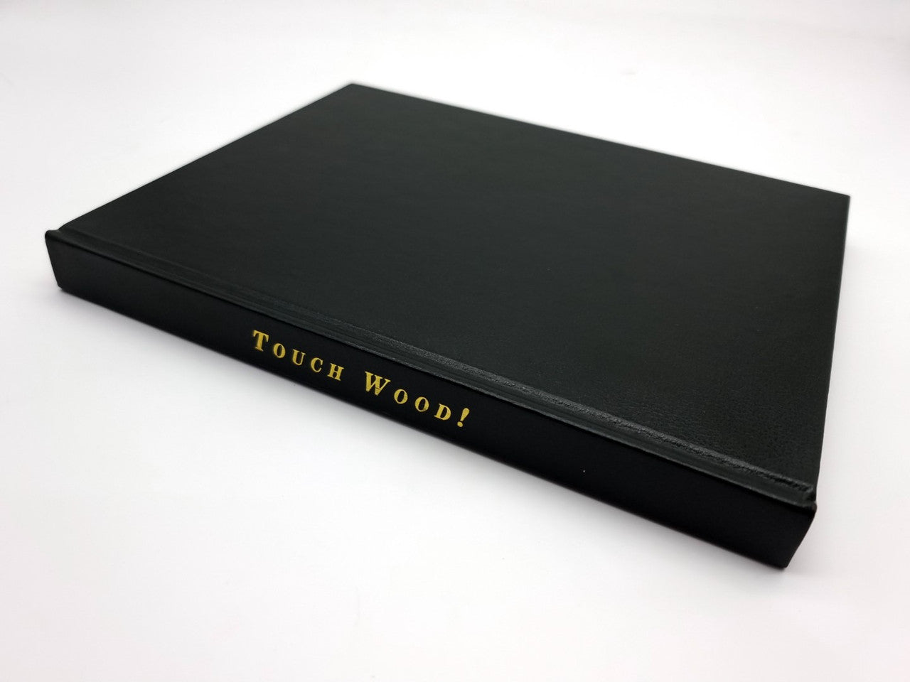 Black presentation case with gold title lettering