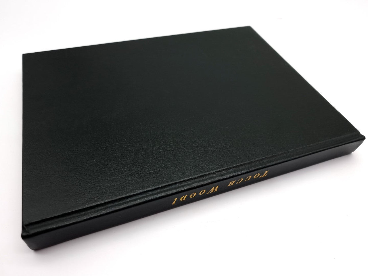 Black presentation case with gold spine text, textured finish