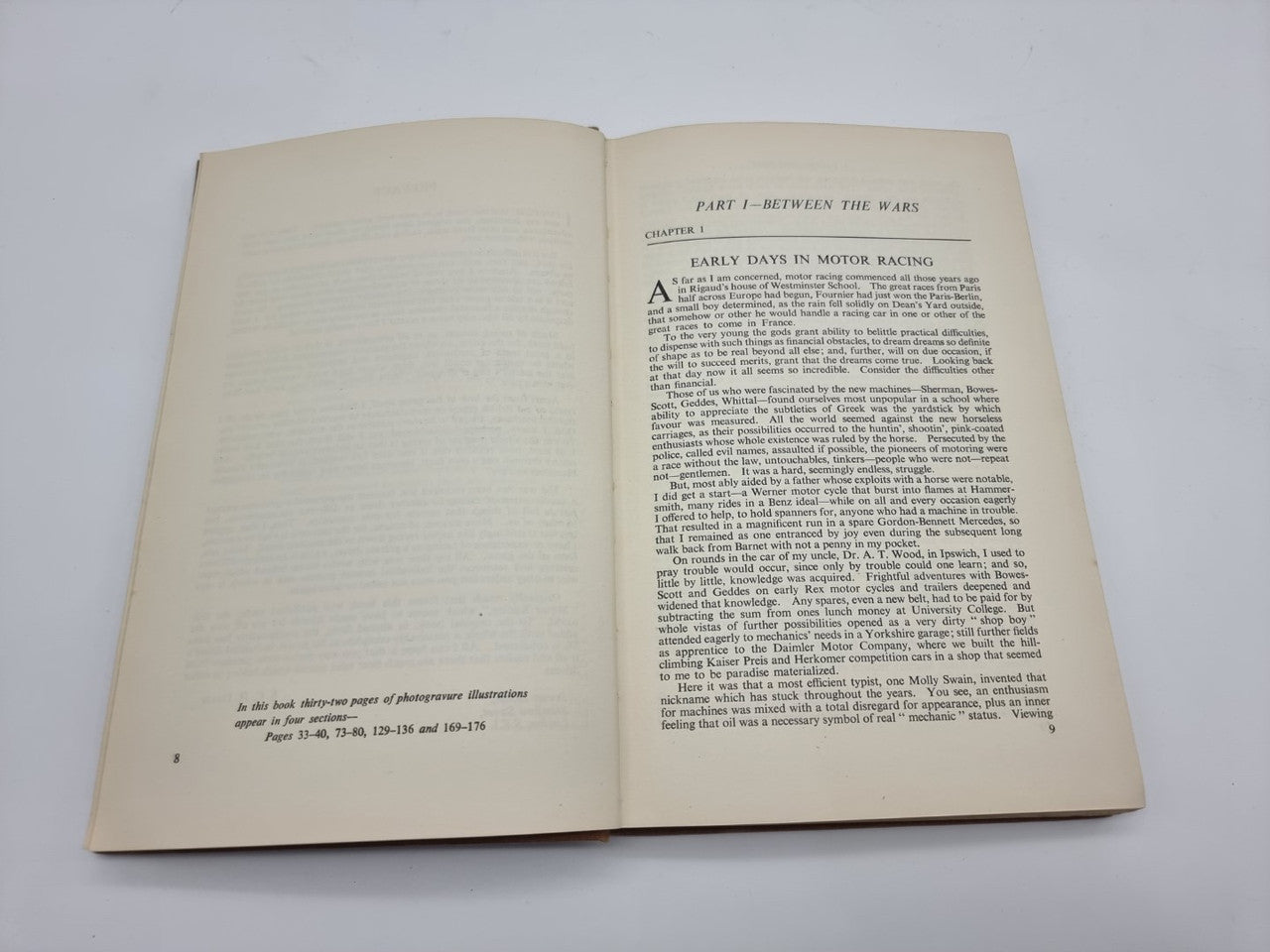 Hardcover book opened to two pages of dense printed chapter text