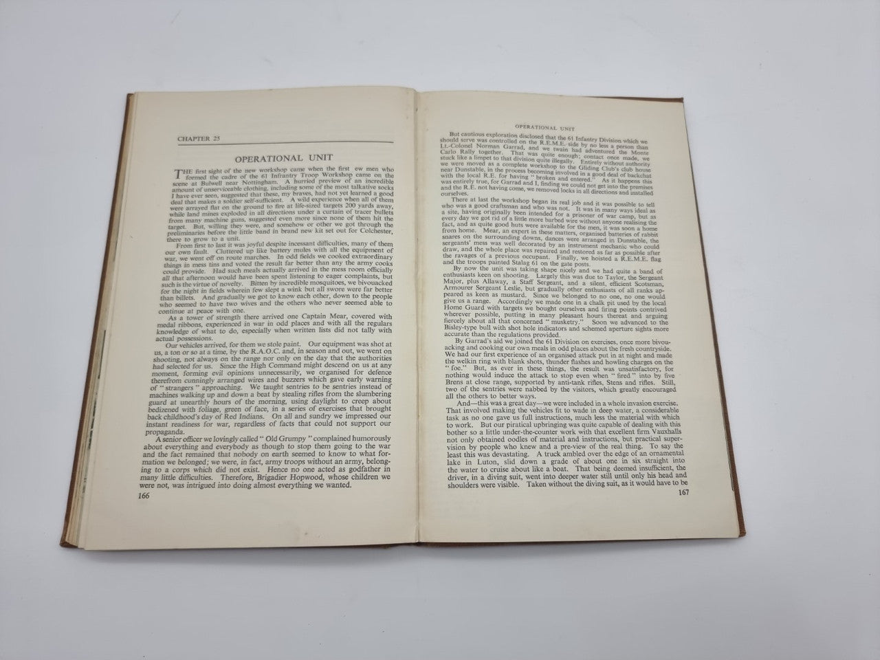 Hardcover book opened to pages of printed text with chapter heading at top