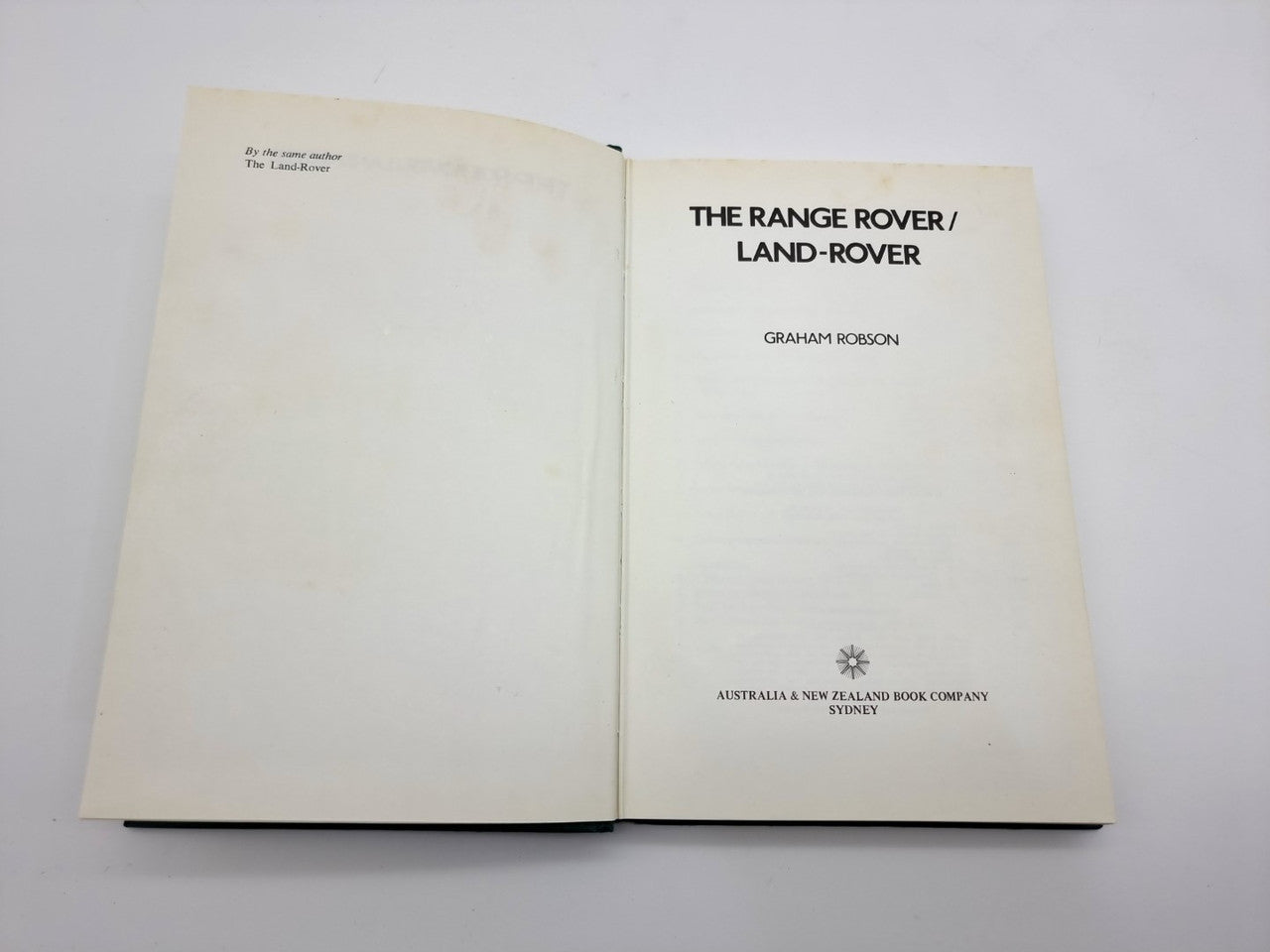 Book titled “The Range Rover / Land-Rover” by Graham Robson, open to title pages