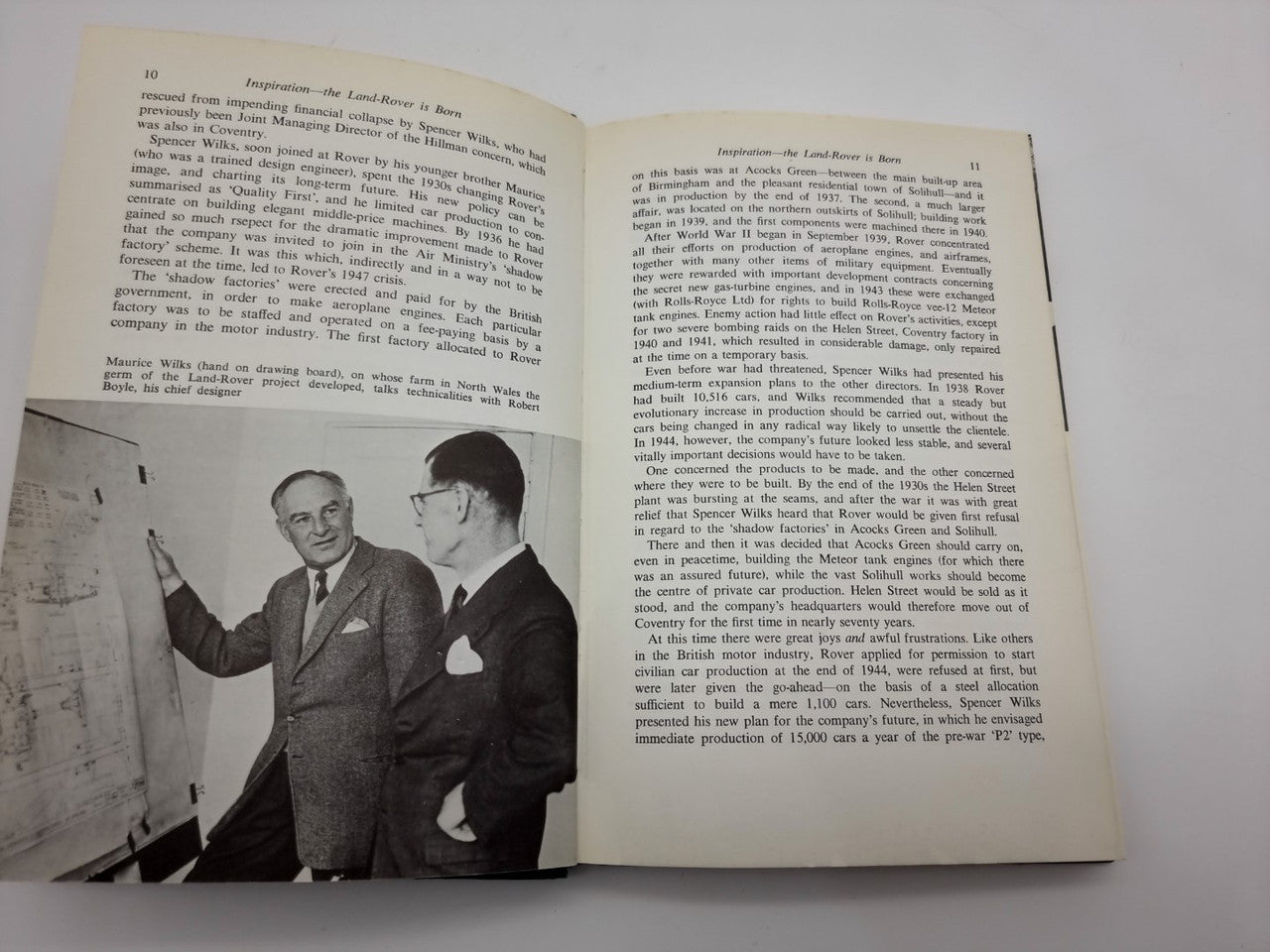 Book open to a chapter page featuring a black-and-white photo of two men