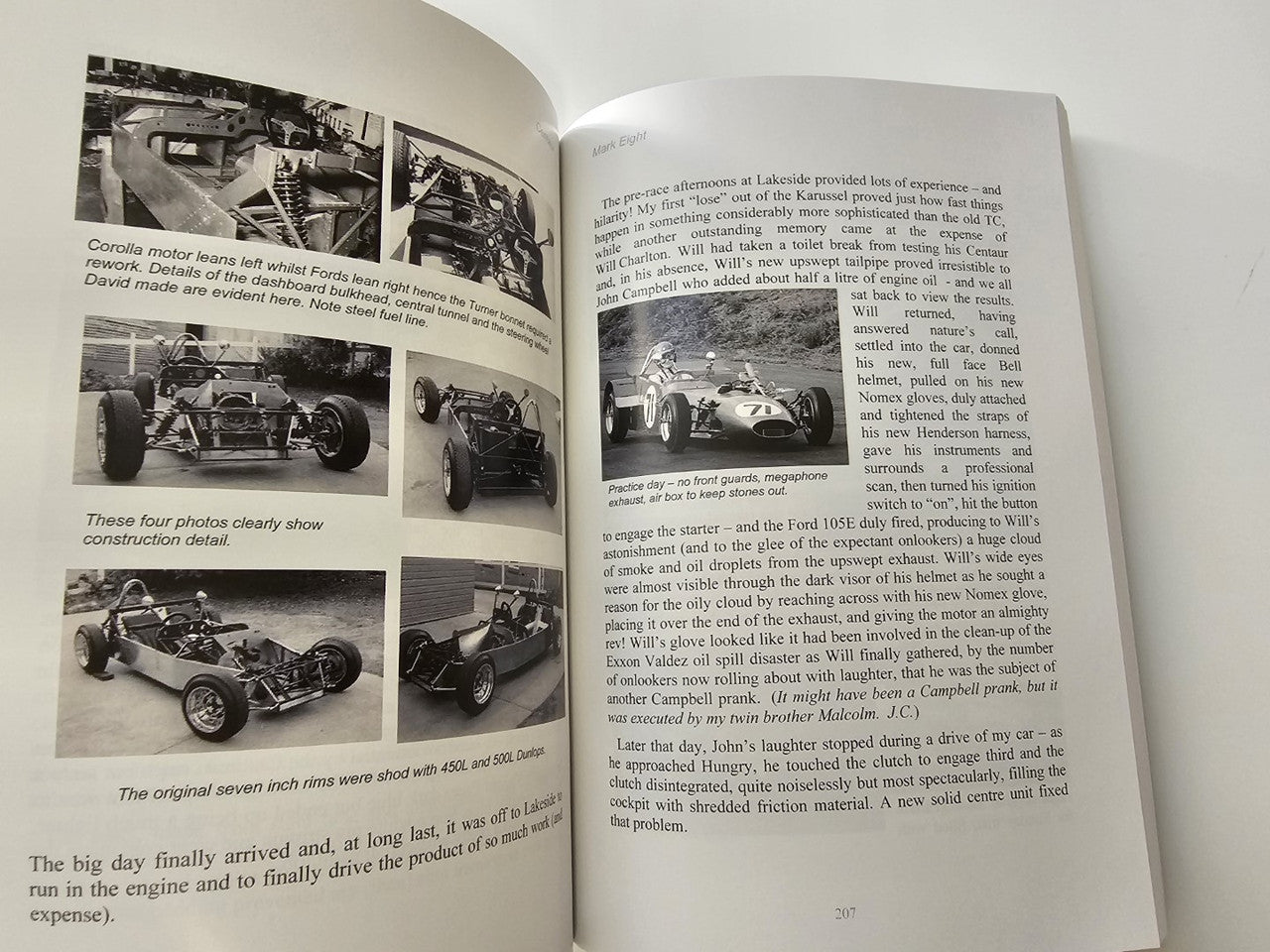 Book spread with multiple vintage race car photos and surrounding text