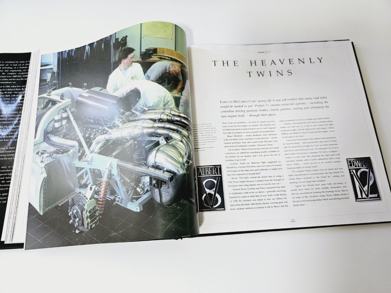 Open book spread with a large photo of a race car engine bay