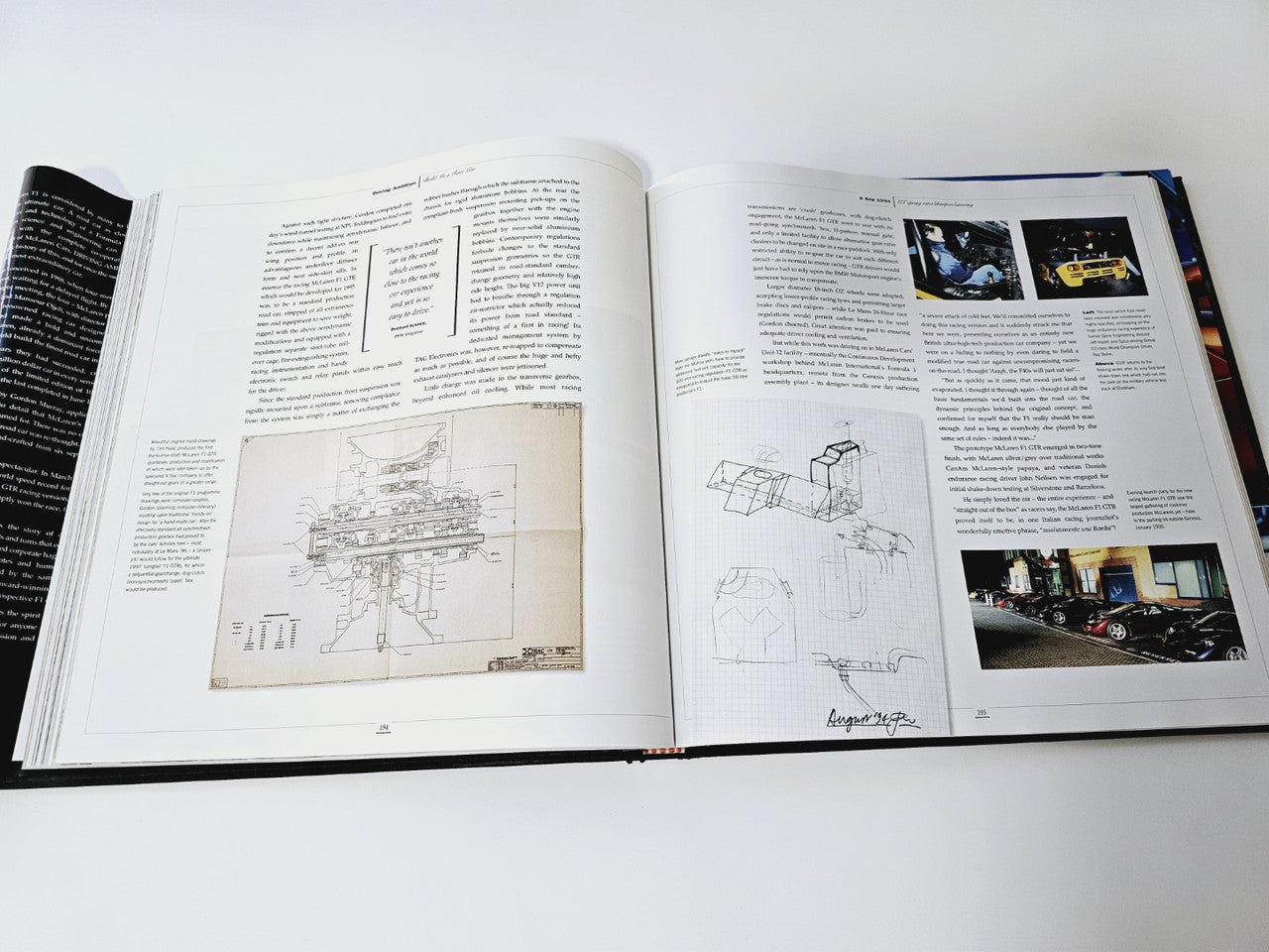 Open book with technical diagrams and annotated engineering sketches
