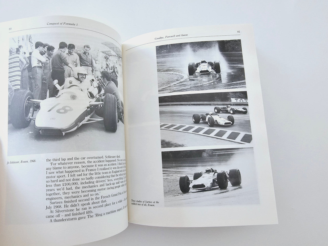 Open book with black-and-white racing photos and printed text pages