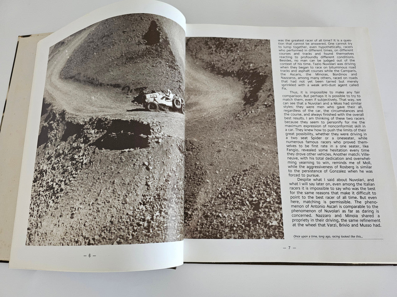 Enzo Ferrari pilots book, open spread with aerial view of cars on a track