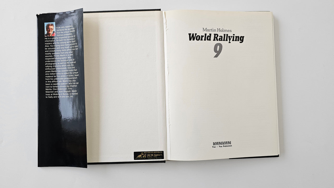 Rallying book open to interior pages with title page on the right and dark page on left