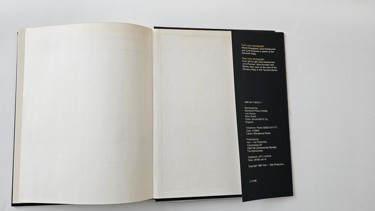 Rallying book open with mostly blank pages and a black bookmark-style side panel