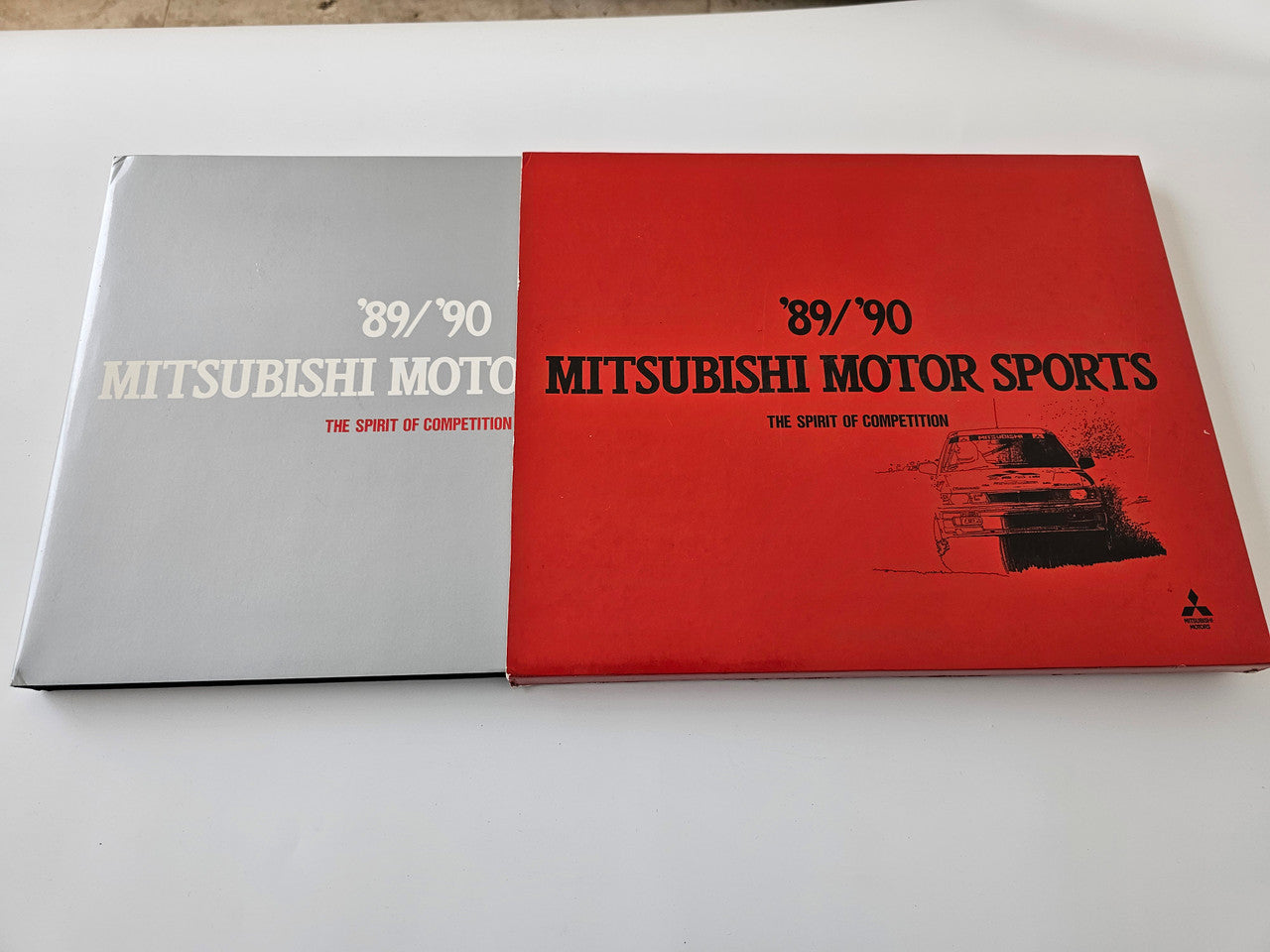 Motorsports booklet with red and white covers, 89/90 Mitsubishi Motor Sports print