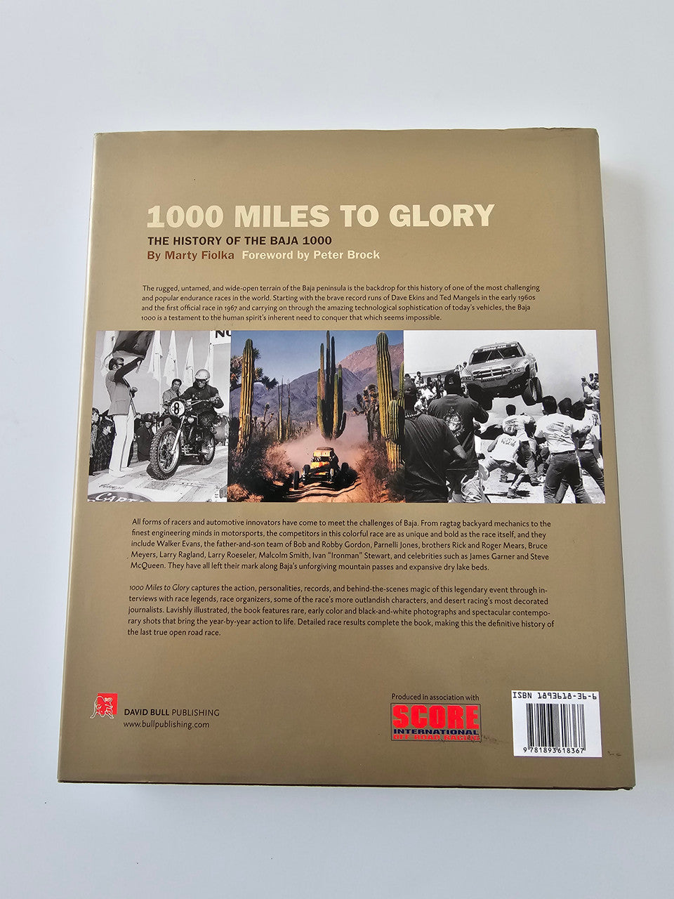 Paperback book, brown back cover with Baja 1000 history photos and barcode.