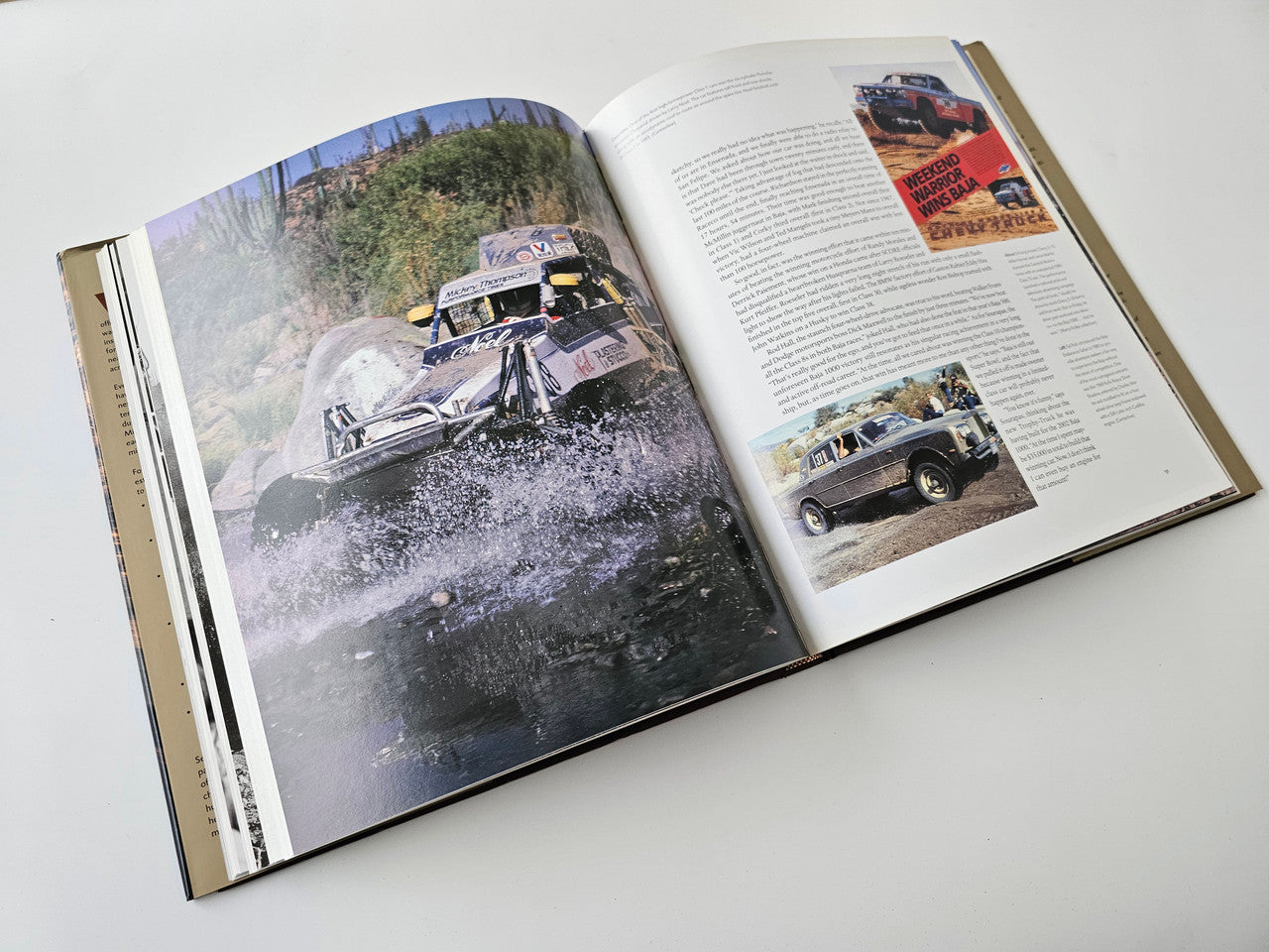 Opened book spread with an off-road race car photo on the left and a right text page.