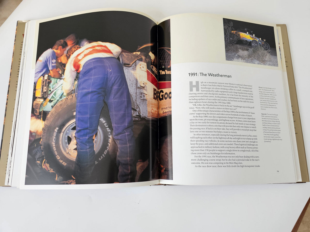 Opened book spread with a worker by a race vehicle and a right text article.