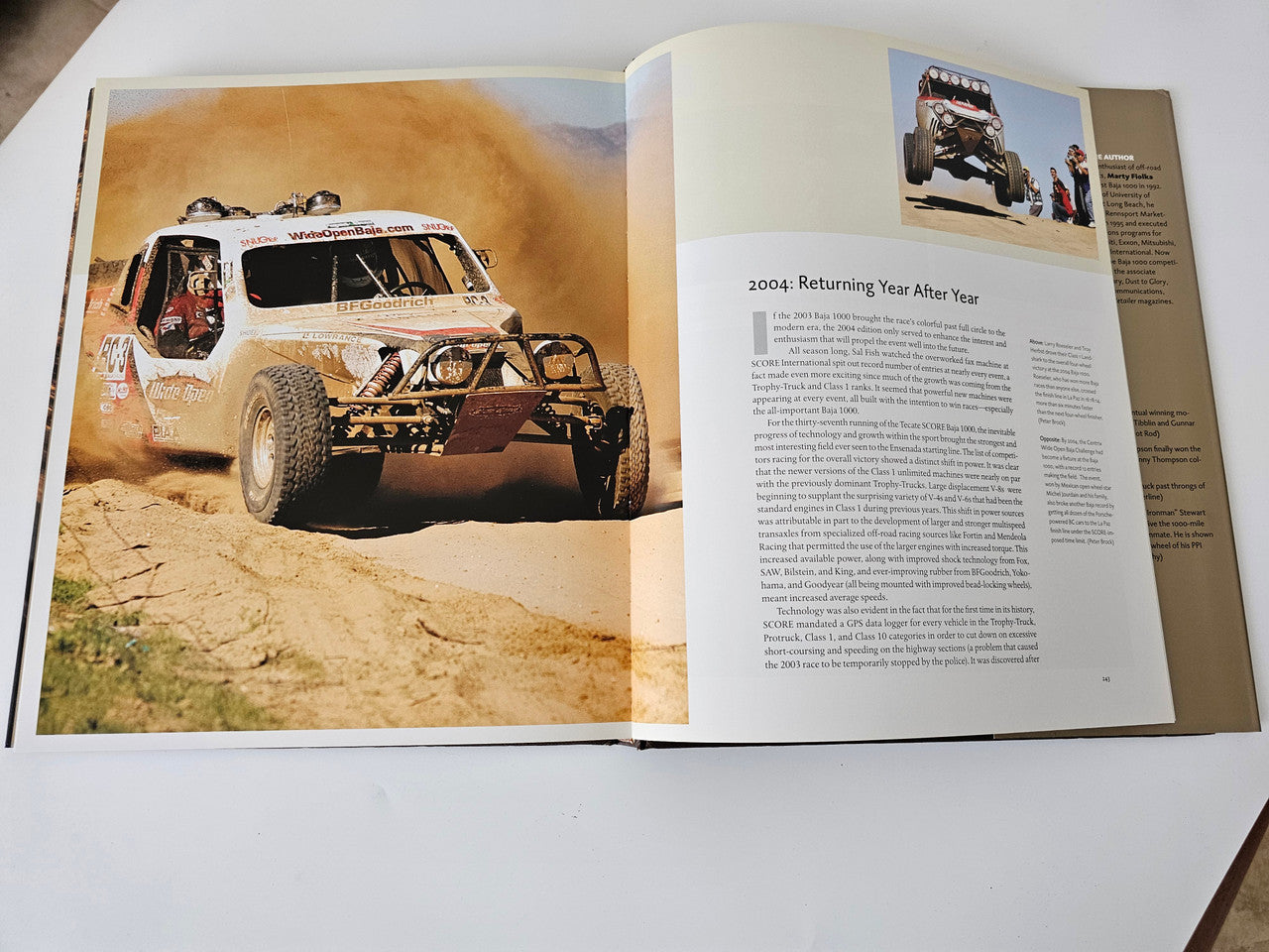 Opened book spread with a desert off-road vehicle photo on the left and text on the right.