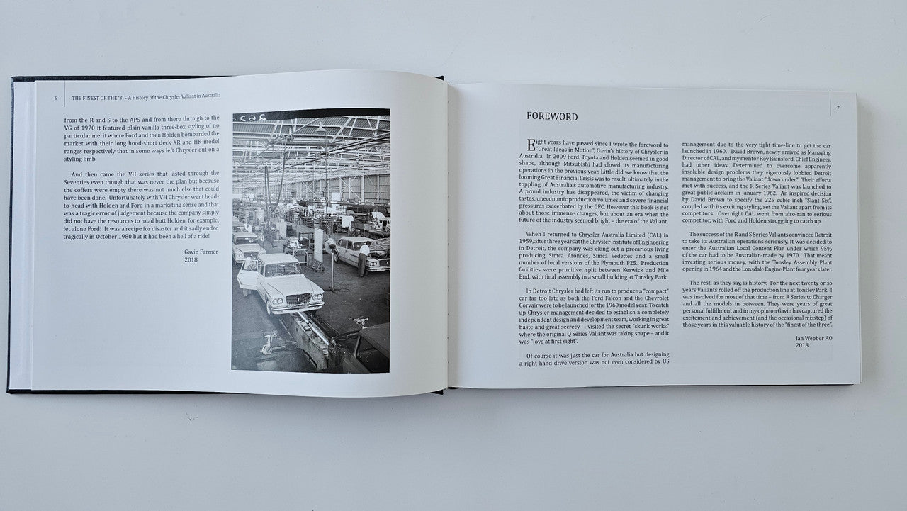 Open book spread with factory photo on left and “Forward” text on right
