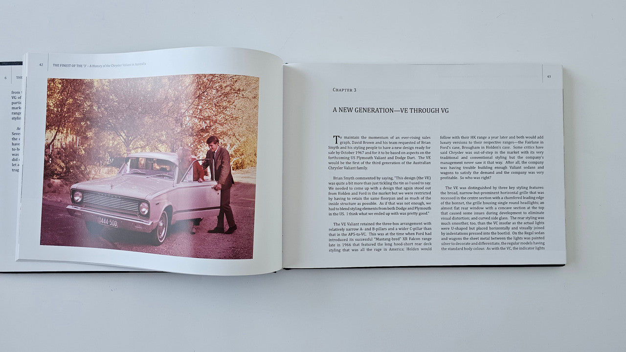 Open book spread with red car photo on left and article text on right