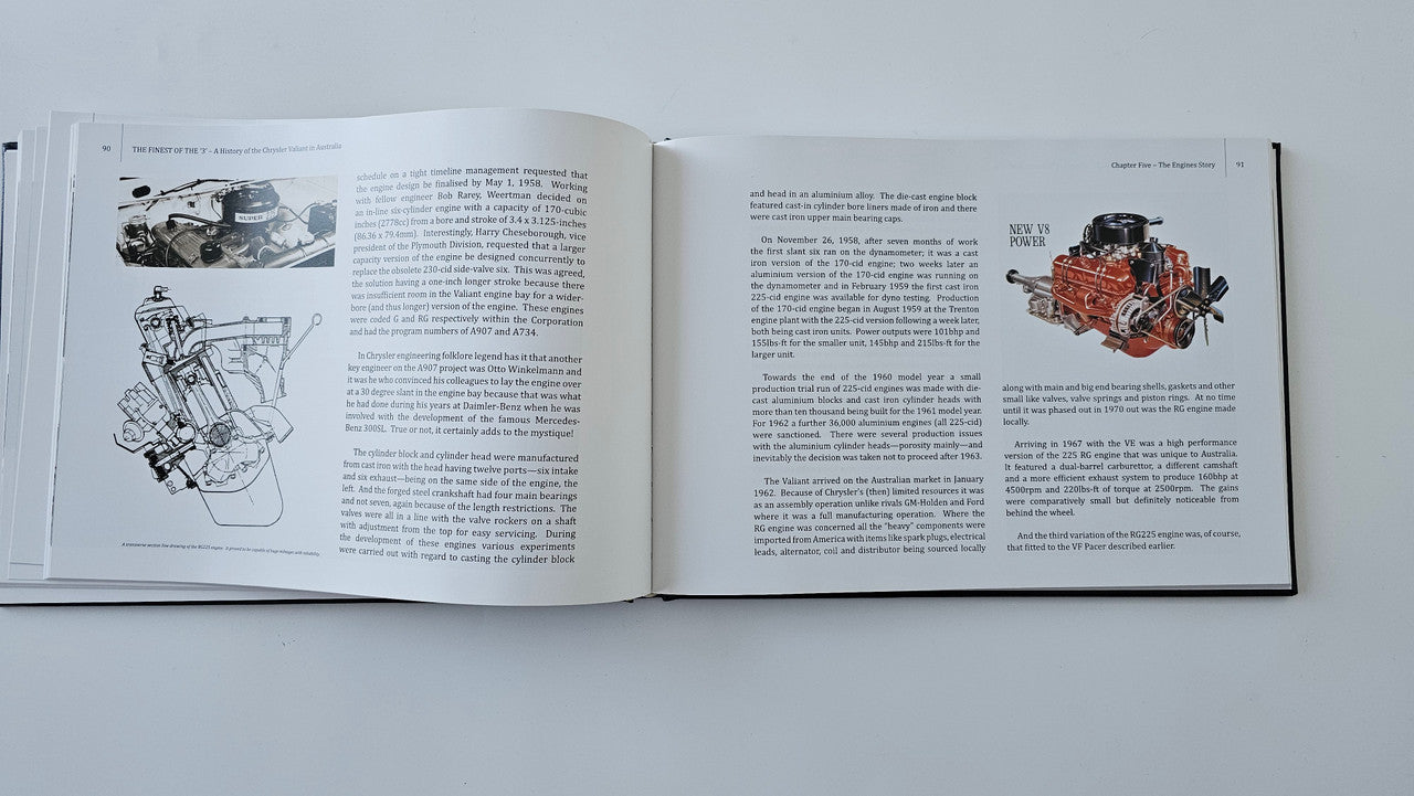 Open hardcover book with illustrated technical diagrams and text pages