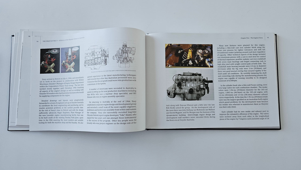 Open hardcover book with color engine photos and technical text pages