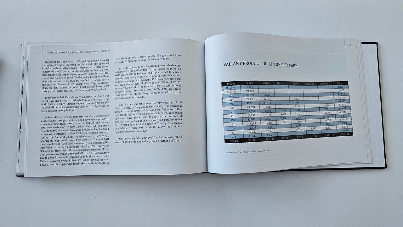 Open hardcover book with a specifications table and dense text pages