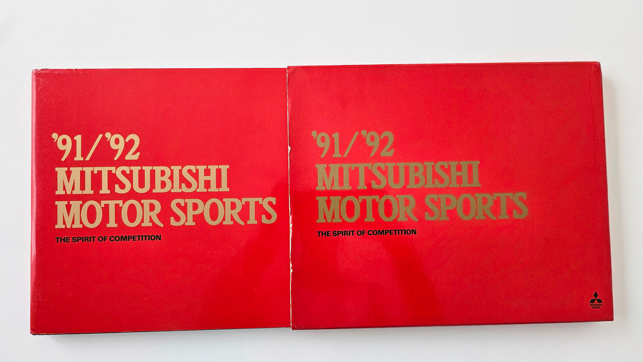 Red book cover with '91/92 Mitsubishi Motor Sports' title text