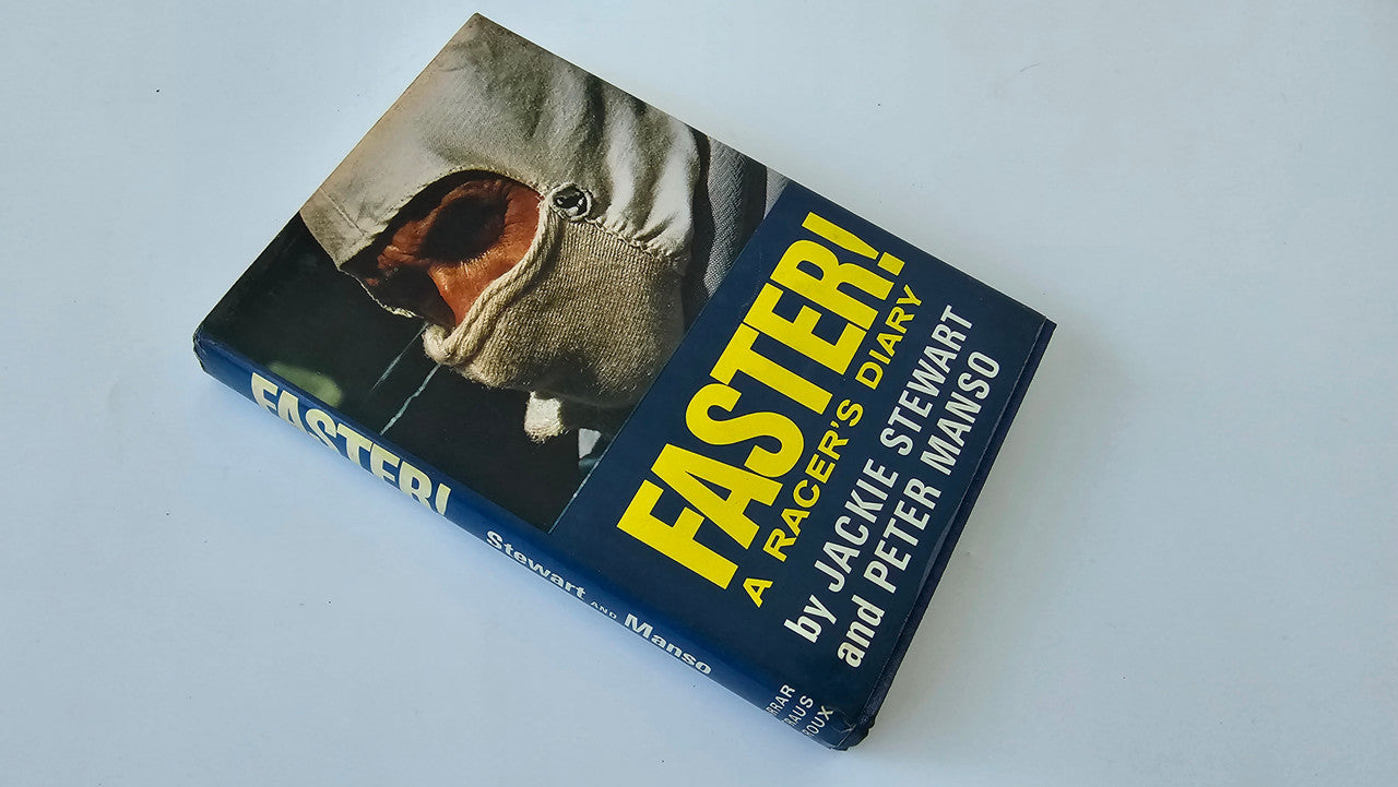 Racing diary book angled on its side with yellow title on blue cover