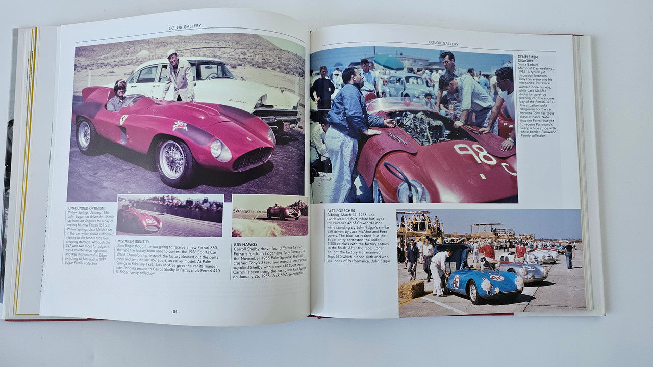 Open sports car racing book with color photos of pink race cars and captions