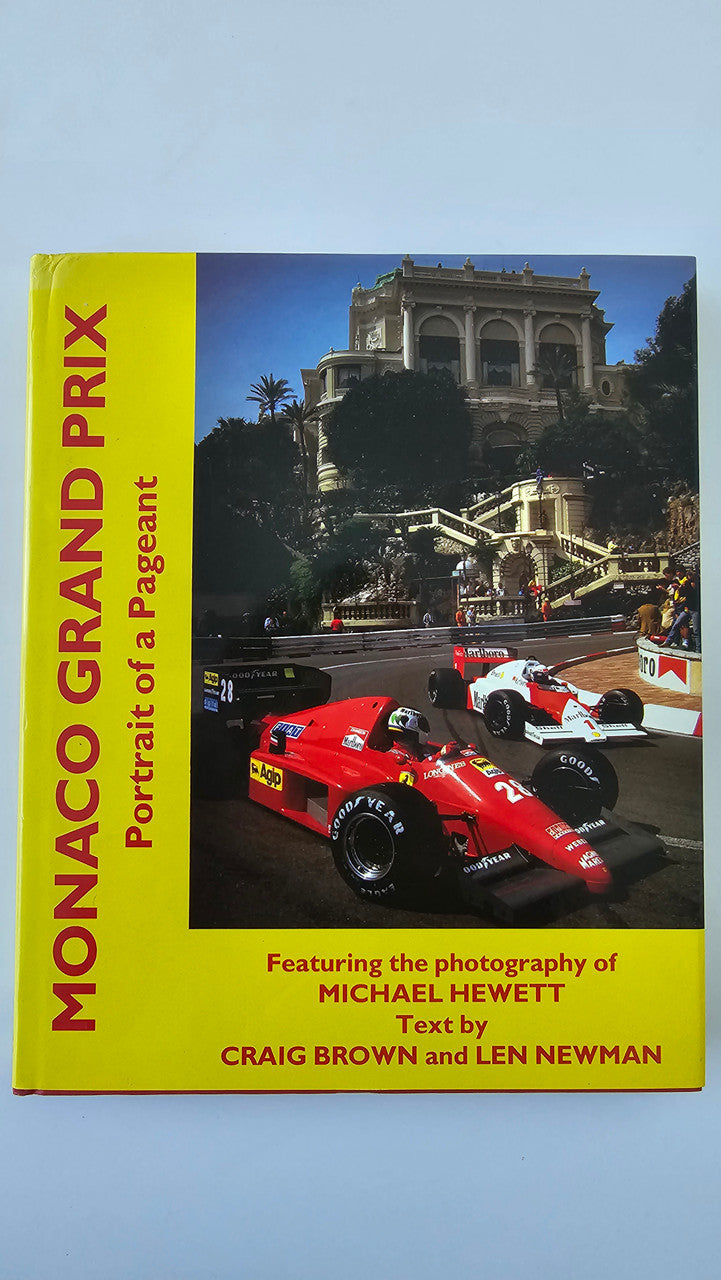 Monaco Grand Prix photo book with red race cars and title on yellow cover