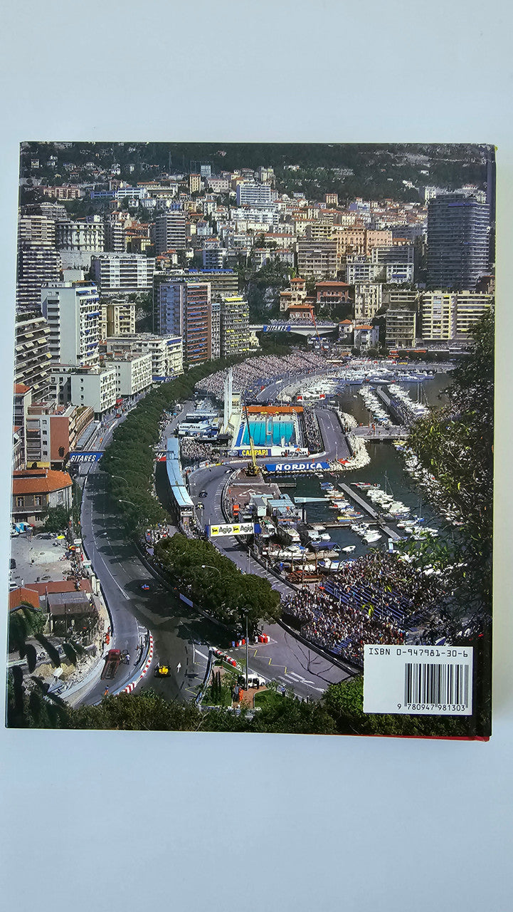 Photo book back cover with aerial view of city streets, harbor, and race event