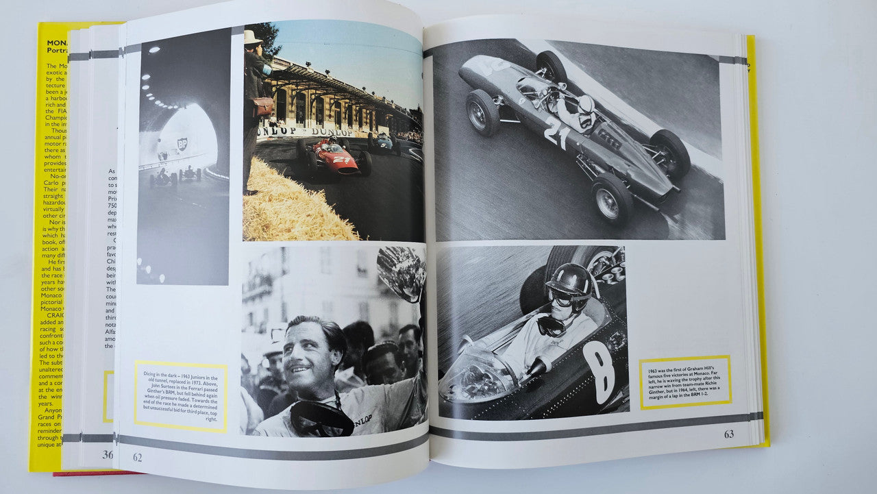 Photo book open to black-and-white car and driver pages with yellow side ribbon