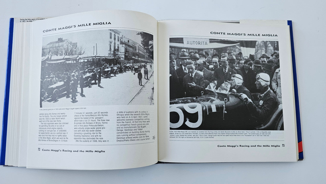Open book with black-and-white racing scenes and crowd photo page