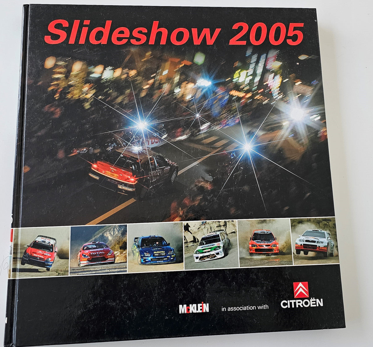 Hardcover car photo book cover, titled Slideshow 2005, with multiple racing cars collage