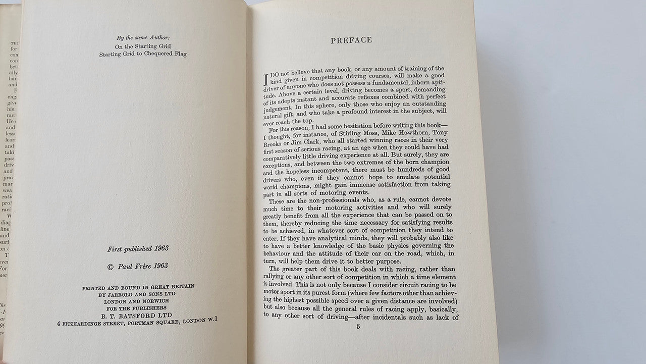 Open book pages with printed text and Preface heading on right page
