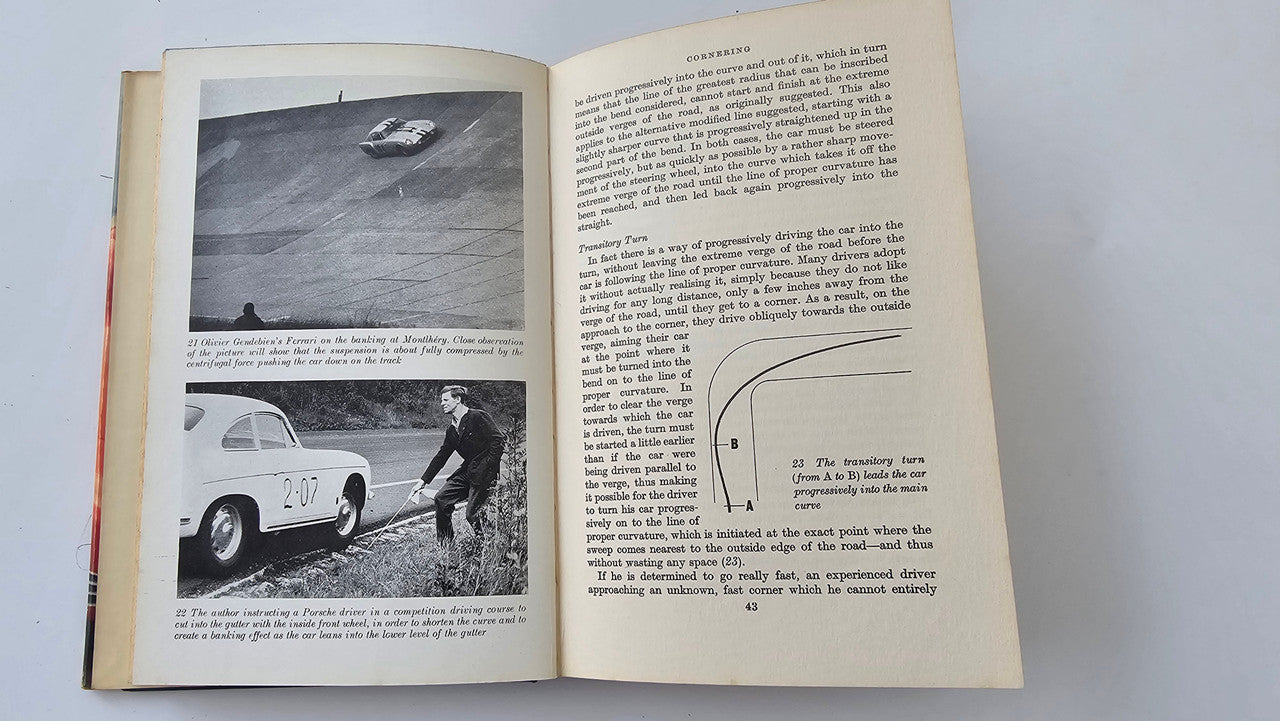 Open book with race car photo on left and printed article text on right