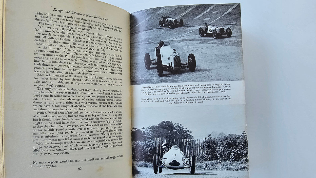 Signed racing car design book, open spread with photos and text paragraphs