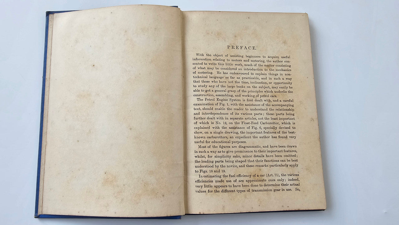 Motors and Motoring book open: blank left page, 'Preface' on right