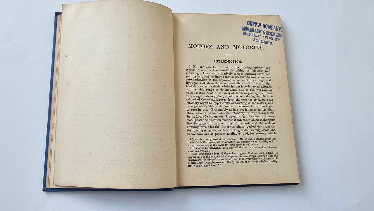 Motors and Motoring book open: 'Motors and Motoring' article text