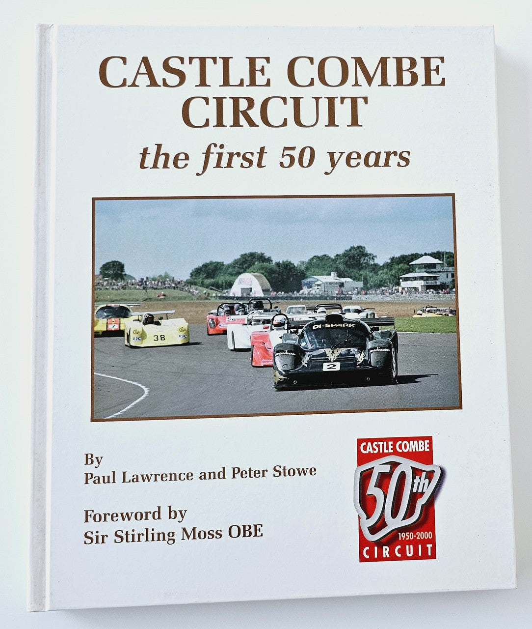 Motorsport history book cover with CASTLE COMBE CIRCUIT title and car photo