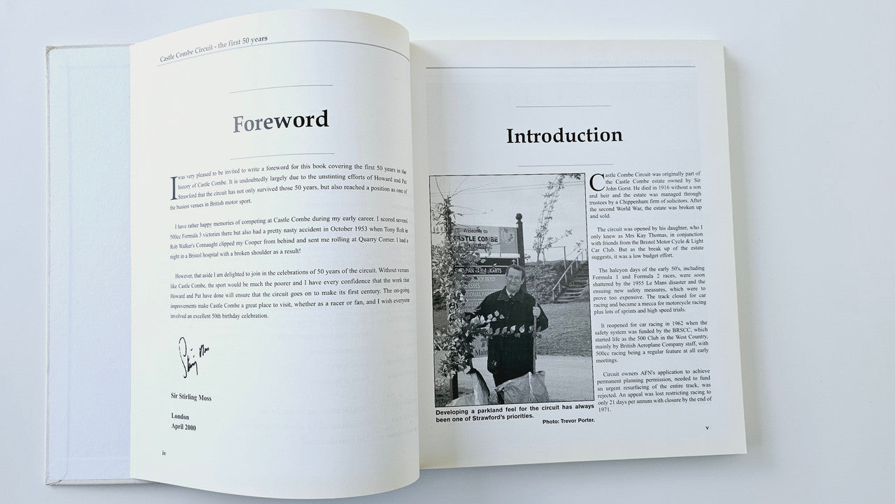 Open book showing foreword and introduction pages with a black-and-white photo