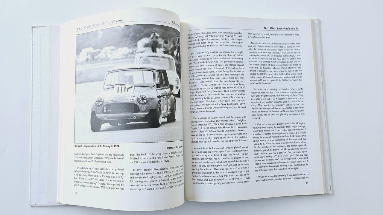 Open book showing a front view car photo on the left and text on the right
