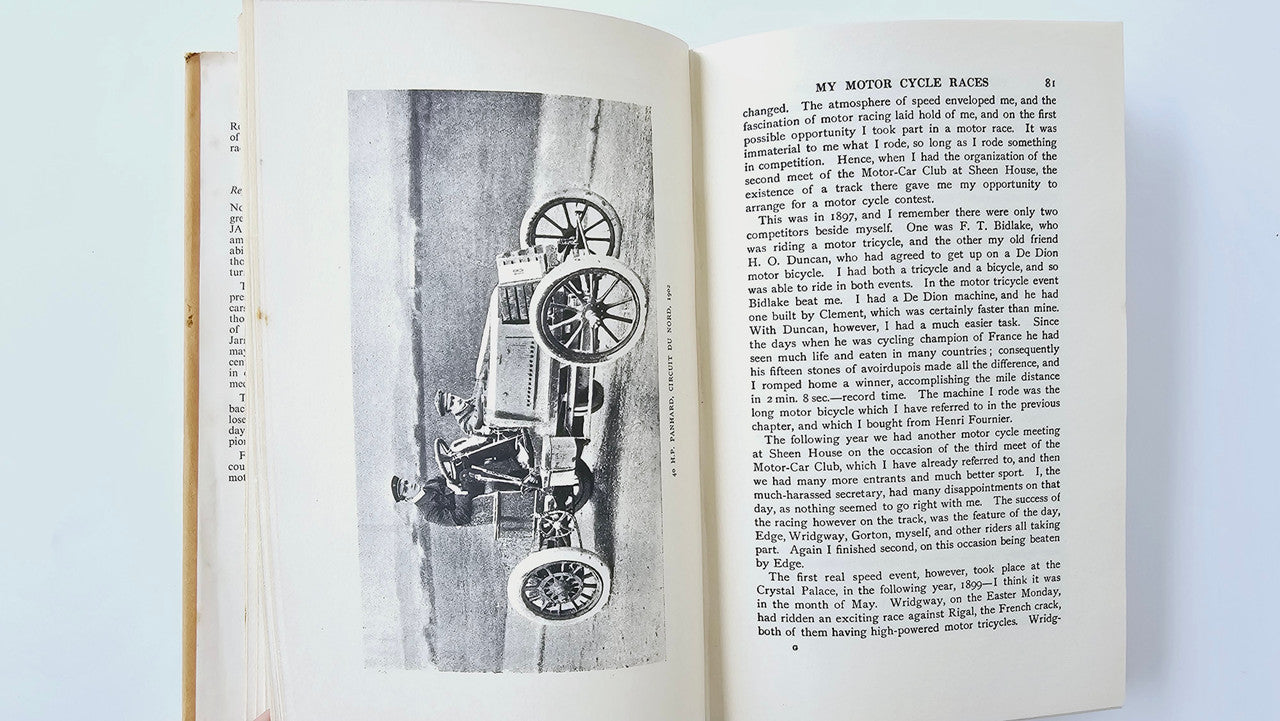 Open vintage book featuring a black-and-white machine photo and dense printed text.