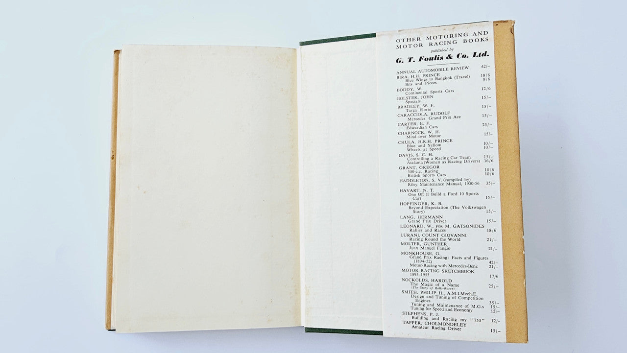 Open vintage book showing table-of-contents style list on right page.