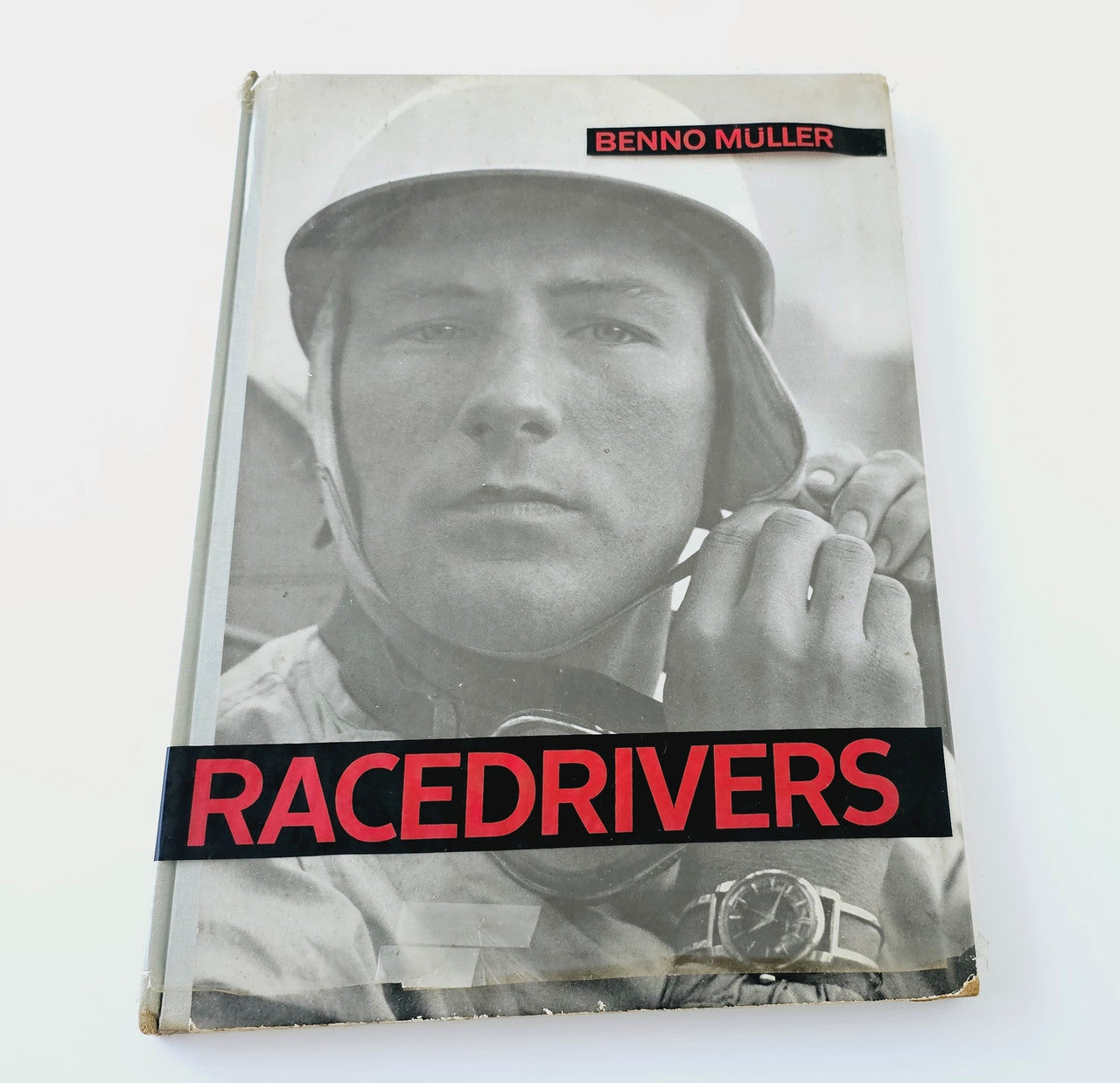 Racedrivers vintage photo book cover with pilot portrait and bold red title