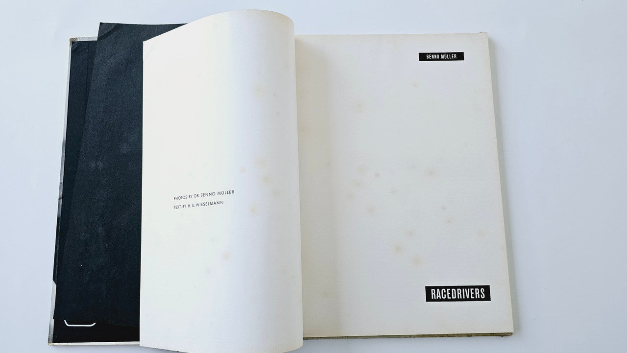 Open vintage photo book showing title page and race title on right page