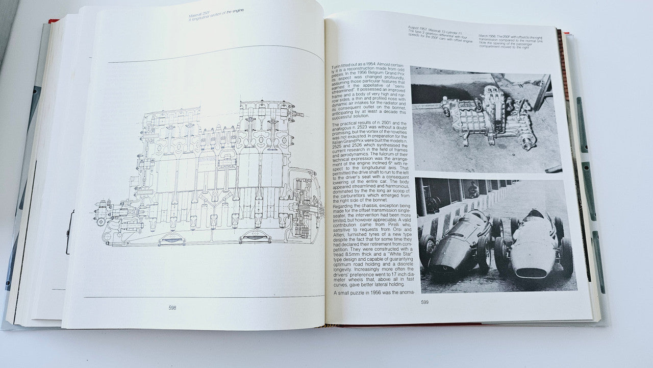 Classic car history book open to technical engine diagrams