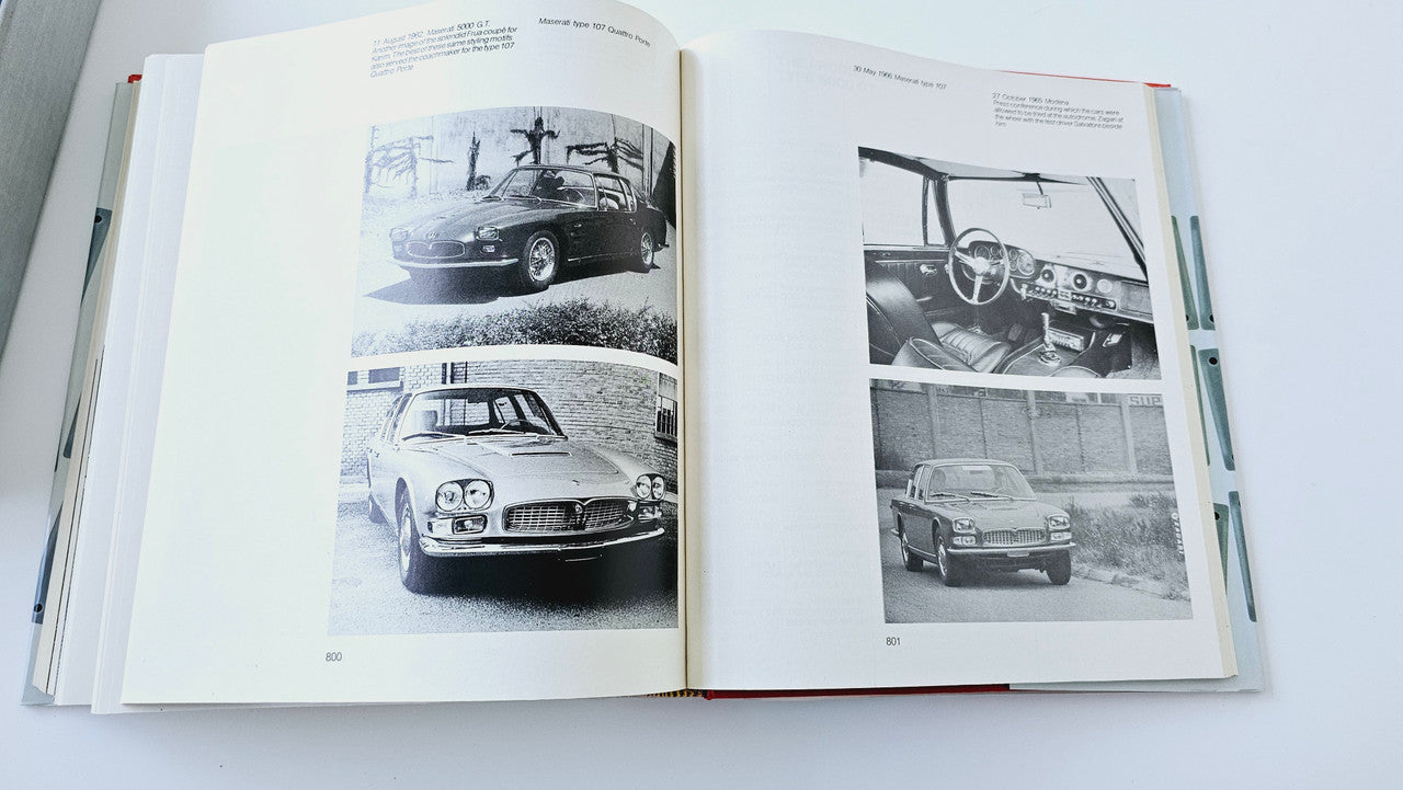 Classic car history book with photo plates on open pages