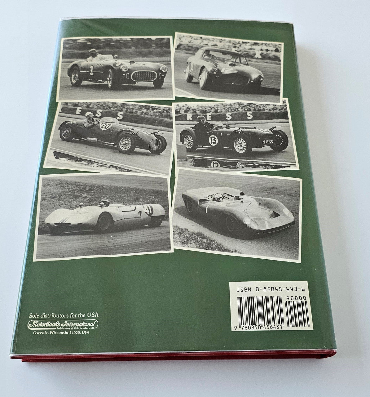 Sports racing book back cover with collage of black-and-white cars and barcode